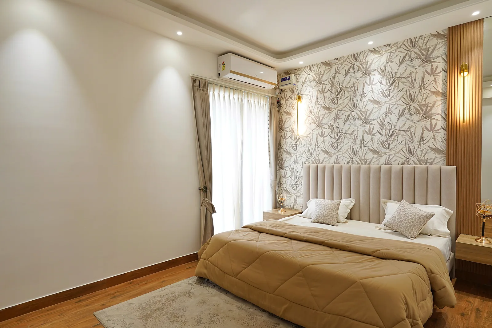Serene master bedroom at AIGIN Royal with upholstered headboard and floral feature wall