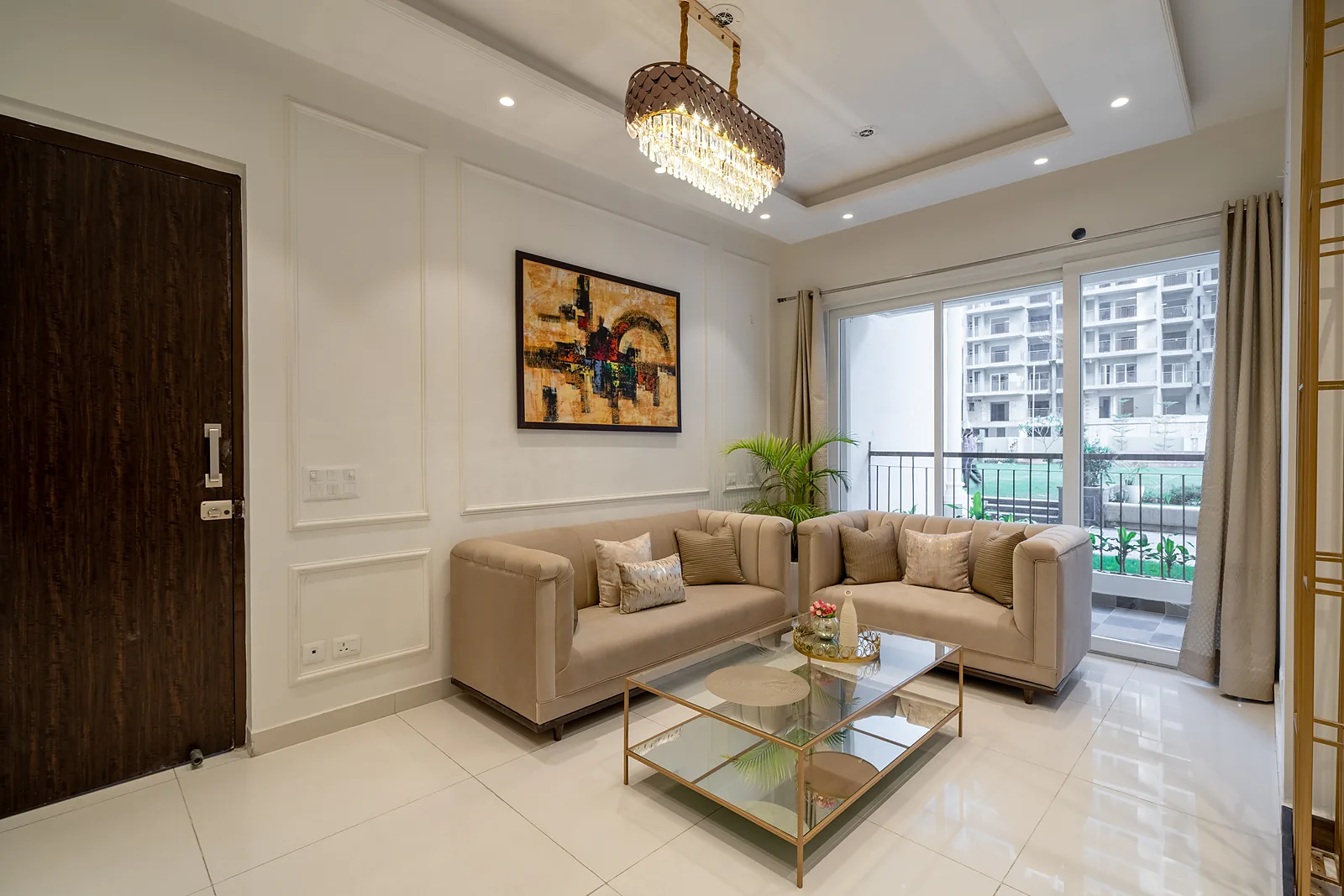 Elegant living room in an AIGIN Royal residence with balcony and designer lighting