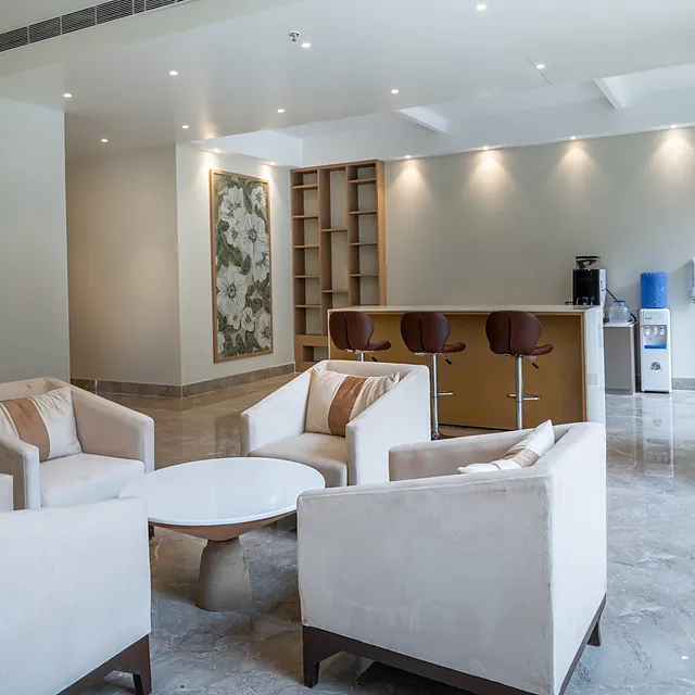 Family clubhouse lounge at AIGIN Royal with seating and bar counter