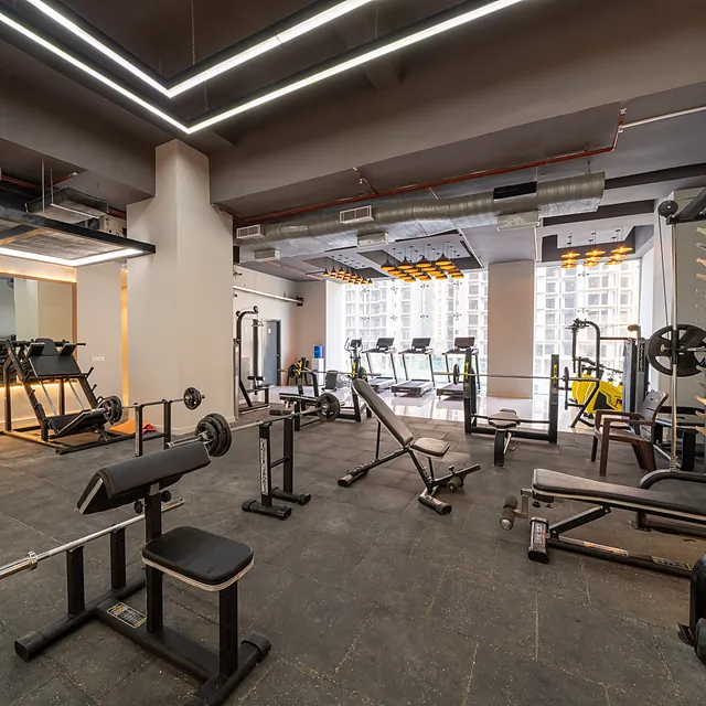 Fully equipped fitness centre at AIGIN Royal with strength and cardio machines