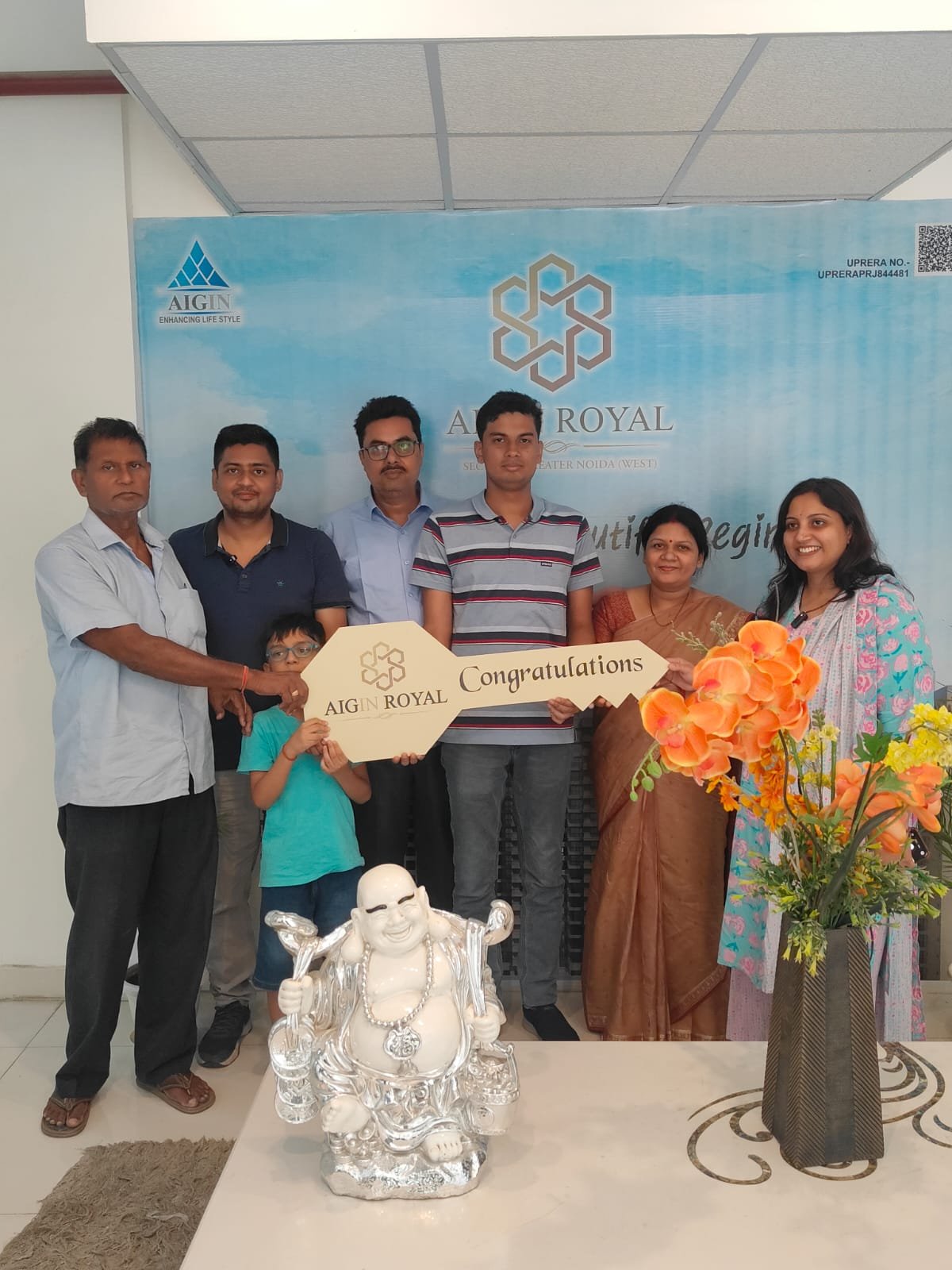Homeowners with the AIGIN Royal key after an on-time handover