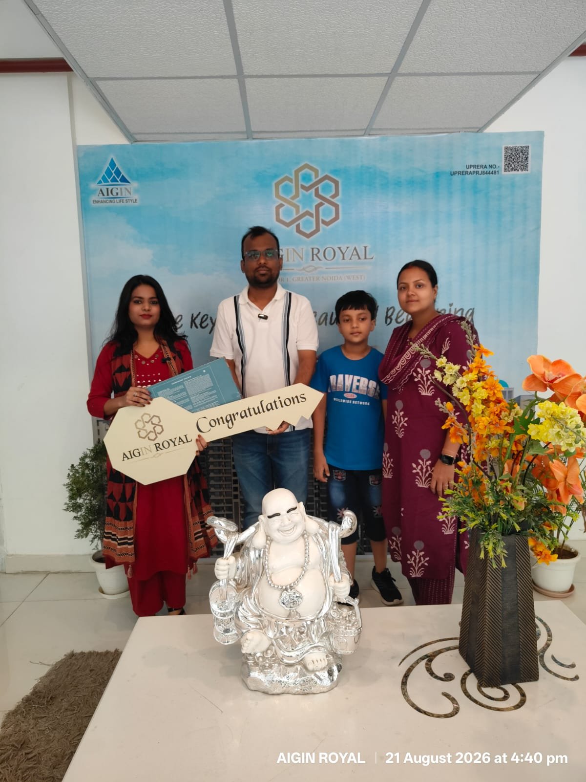 A family with their son at their AIGIN Royal key handover