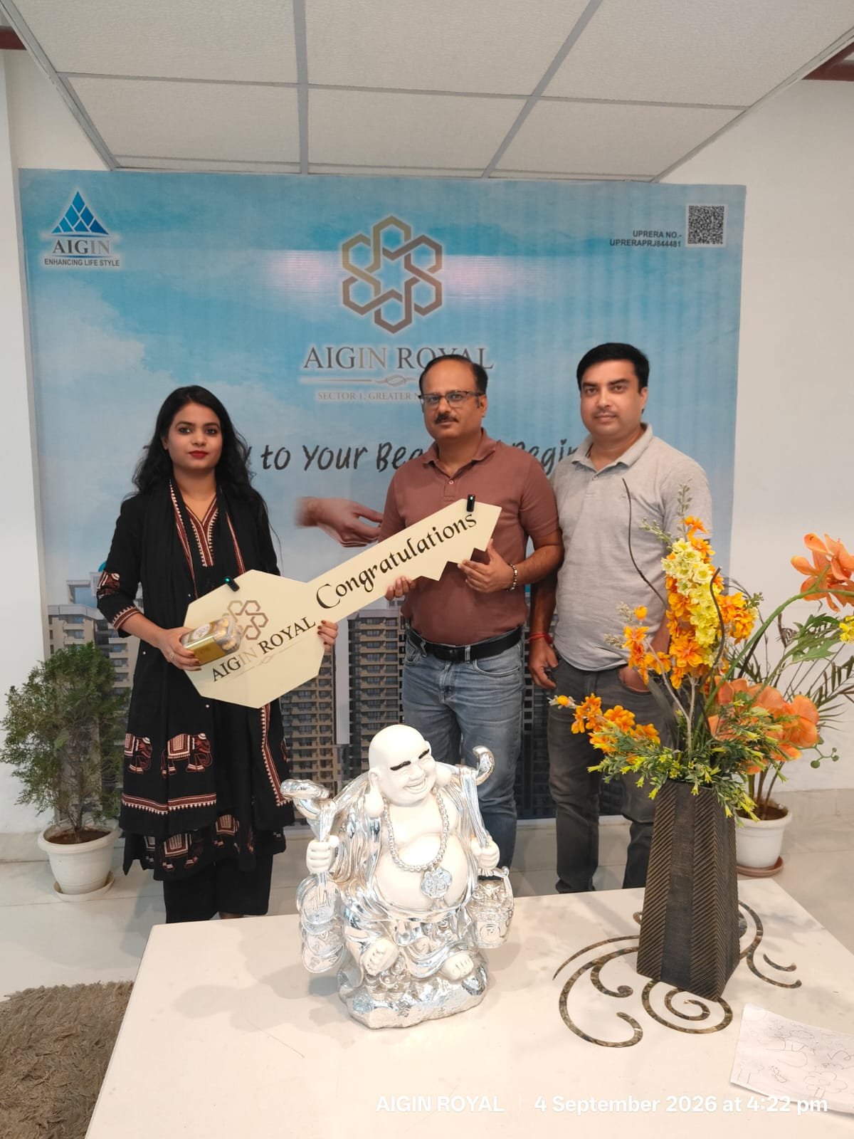 Homeowners receiving the keys to their AIGIN Royal flat at the handover ceremony